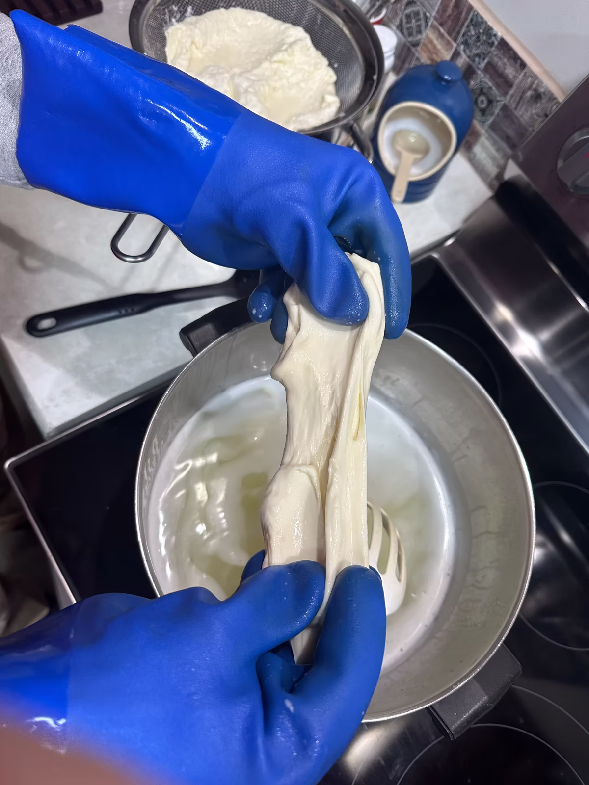 Starting to stretch mozzarella